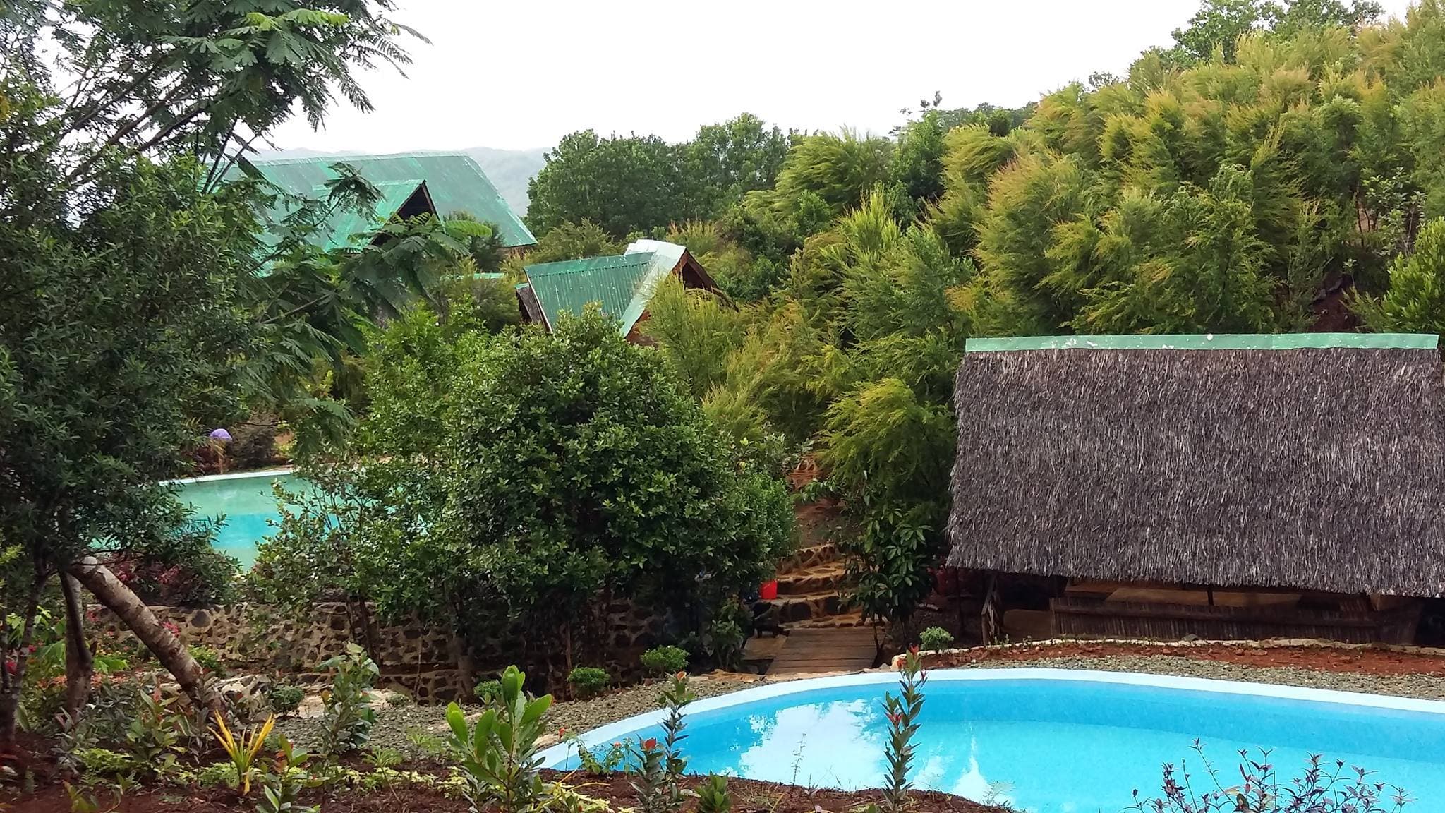 Ecopark Grande's cottages and swimming pool in Barangay Del Pilar