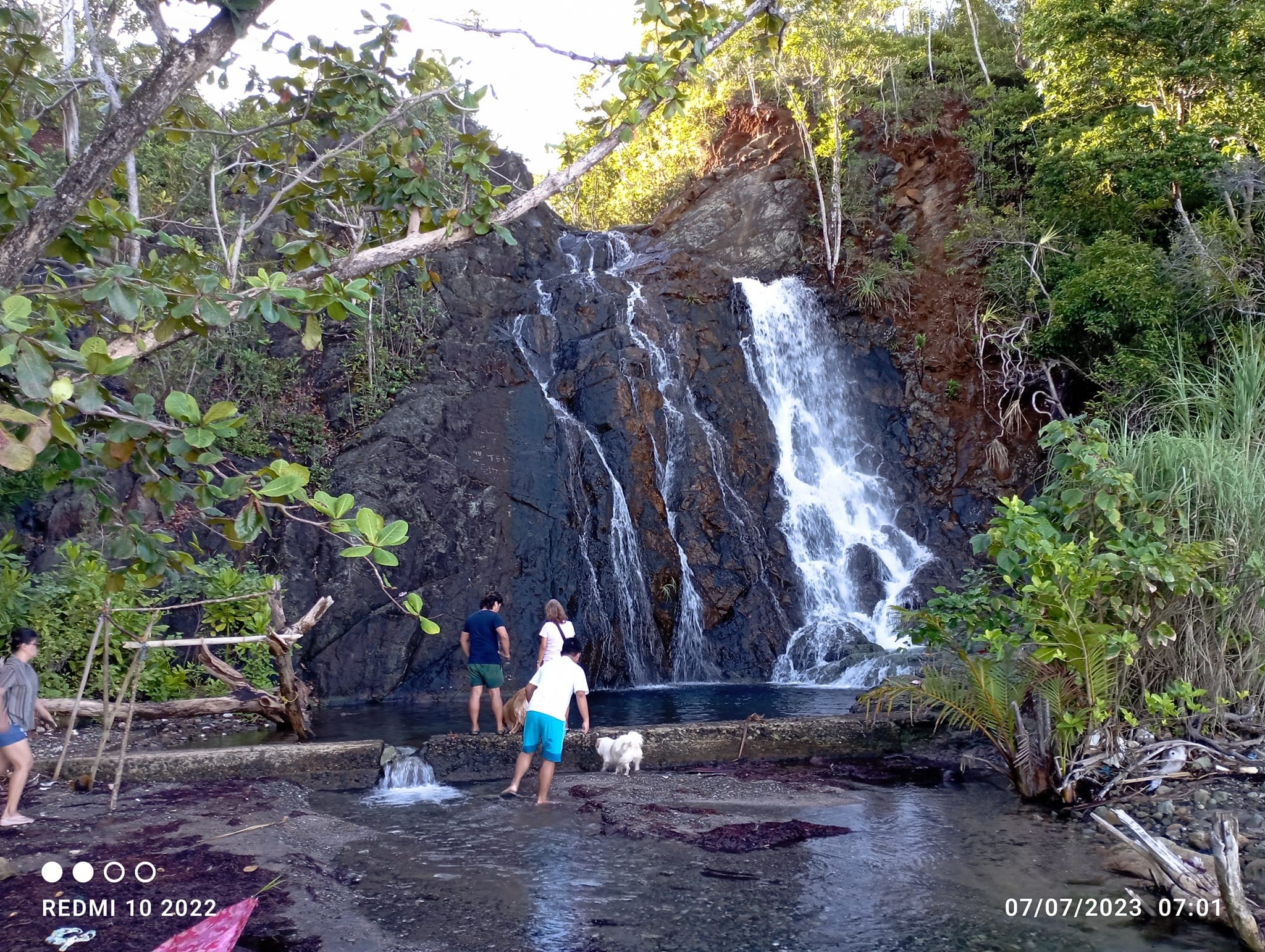 Magkahuyog Falls cascading through the forest in Barangay Pamosaingan